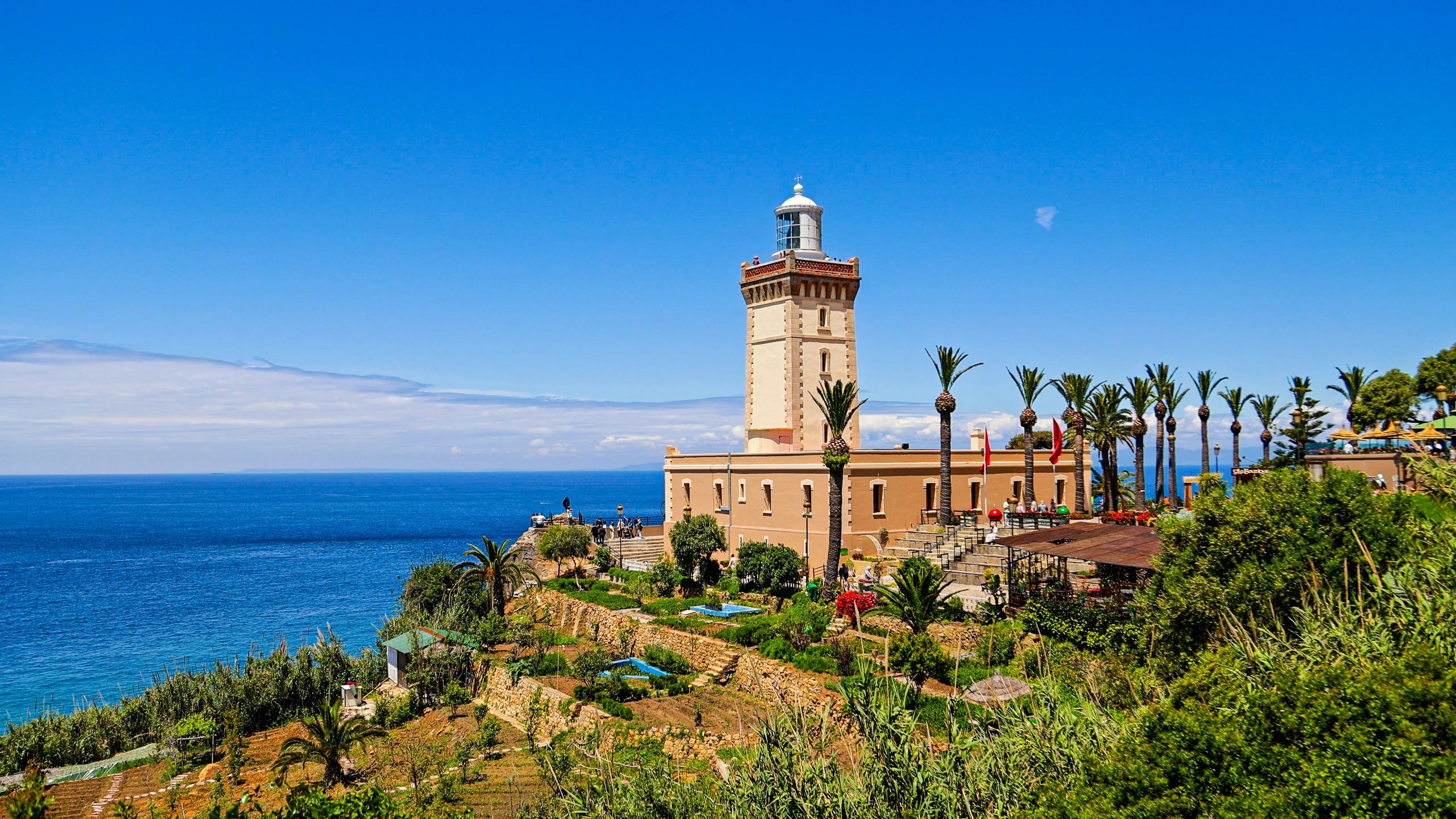 Lighthouse on a calm coastline representing guidance and hope